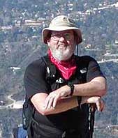 Bob Dollins with JPL behind him